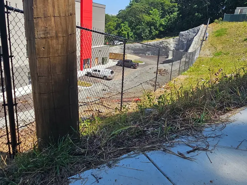 Black chain link fence on a commercial site