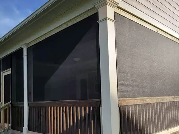 Screened-in back porch on a house with vinyl siding